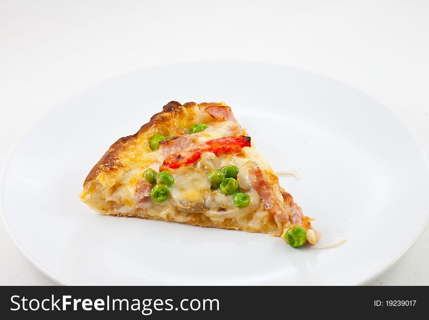 A piece of pizza in white dish