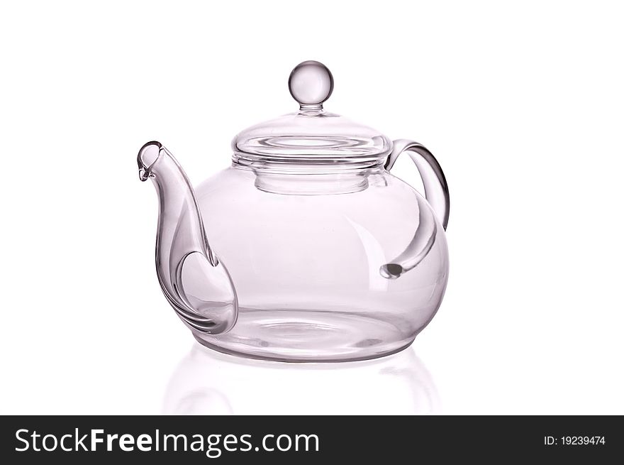 Glass teapot against white background