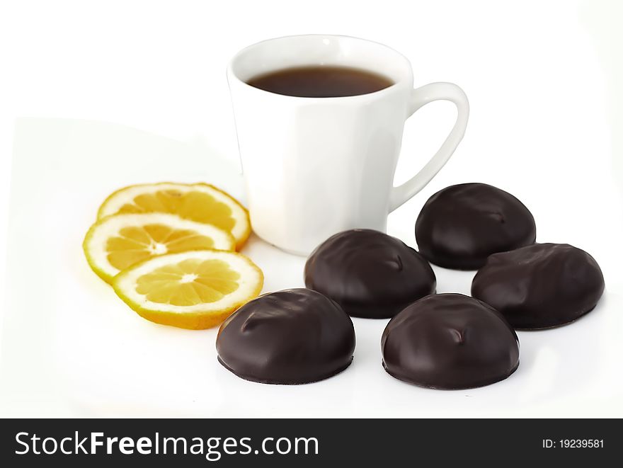 Chocolates, lemon and cup of tea. Chocolates, lemon and cup of tea