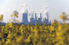 Coal Power Plant And Rapeseed Field Stock Photography