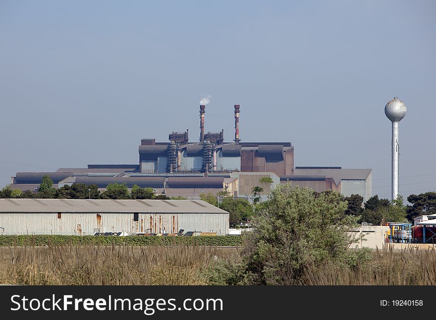 Industrial plant rejecting fumes in atmosphere. Industrial plant rejecting fumes in atmosphere