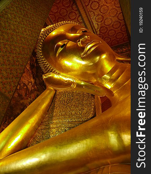 Reclining golden buddha statue in Wat Pho. Reclining golden buddha statue in Wat Pho