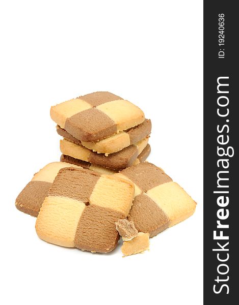 Vanilla and cocoa biscuits with crumbs isolated on a white background