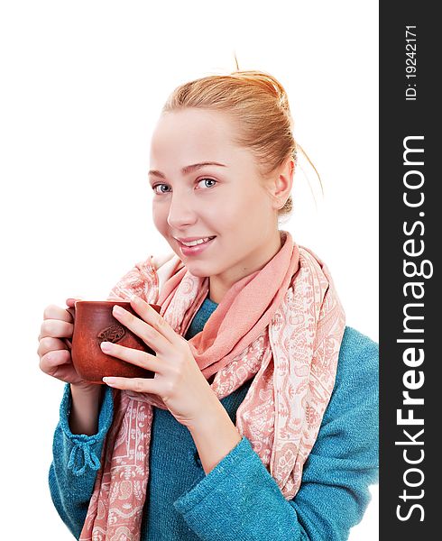 Beautiful blonde girl with cap of tea on a white background