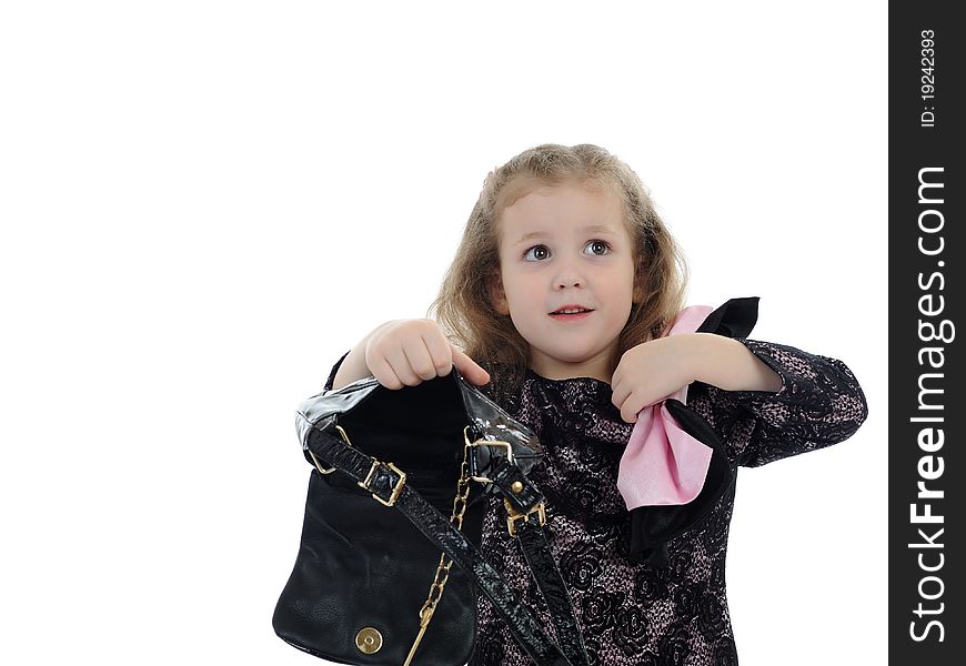 Pretty little child girl in black elegant party dress with empty bag. isolated. Pretty little child girl in black elegant party dress with empty bag. isolated