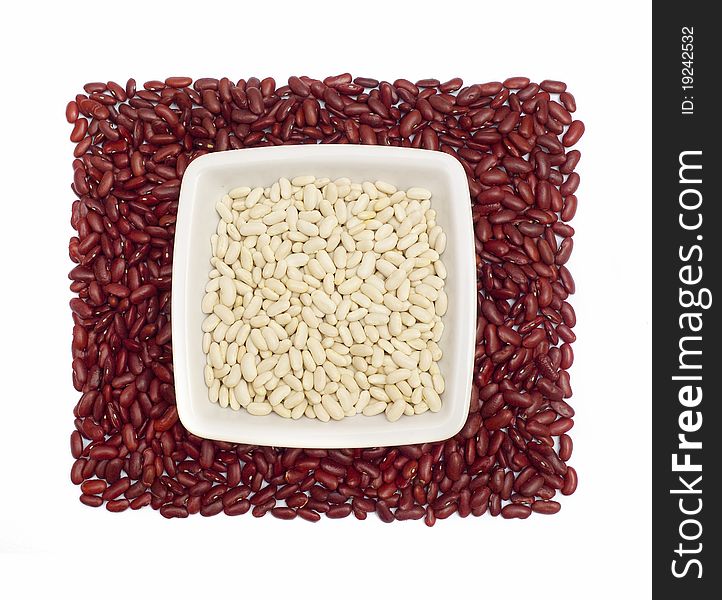 White beans in a dish on kidney beans square isolated on white