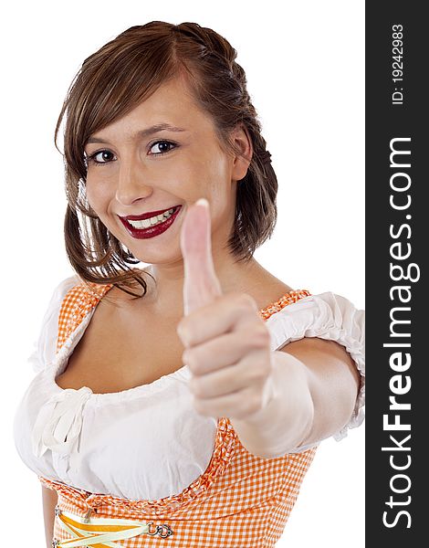 Happy Bavarian woman in Oktoberfest dirndl shows thumb up. Isolated on white background.