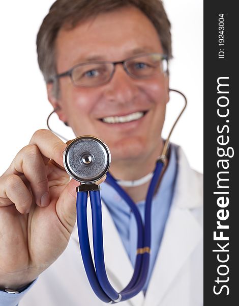 Close-up of a stethoscope, with smiling doctor