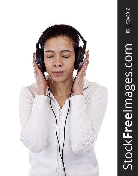Attractive woman with headphones listens to music