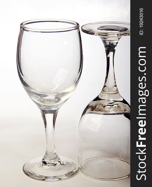 Two glasses on a white surface.