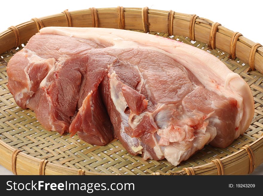 Raw pork meat on white