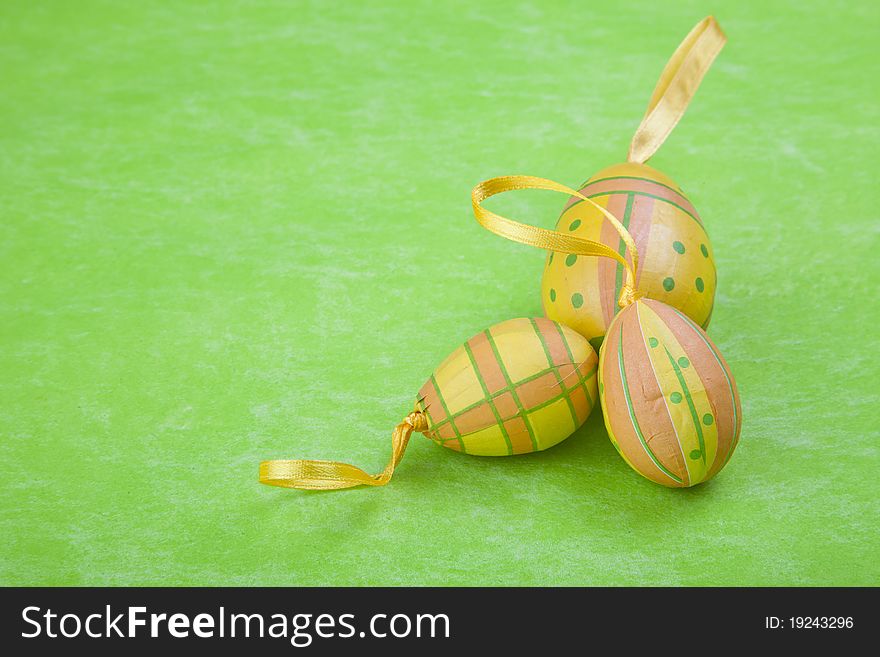 Colorful Easter eggs on a green background