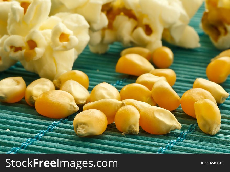 Corn and fresh fried popcorn. Corn and fresh fried popcorn