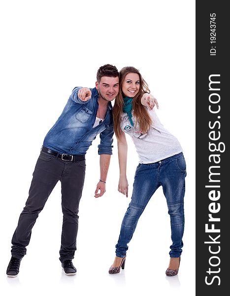 Beautiful couple pointing - isolated over a white background
