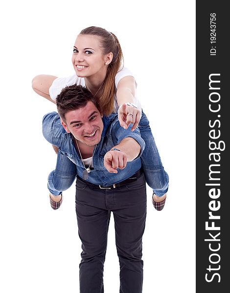 Young man carrying his cute girl on back. woman and pointing to you