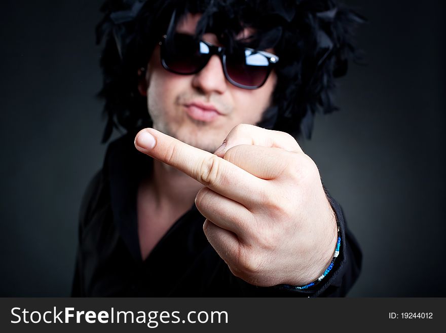 Man wearing a black feather wig