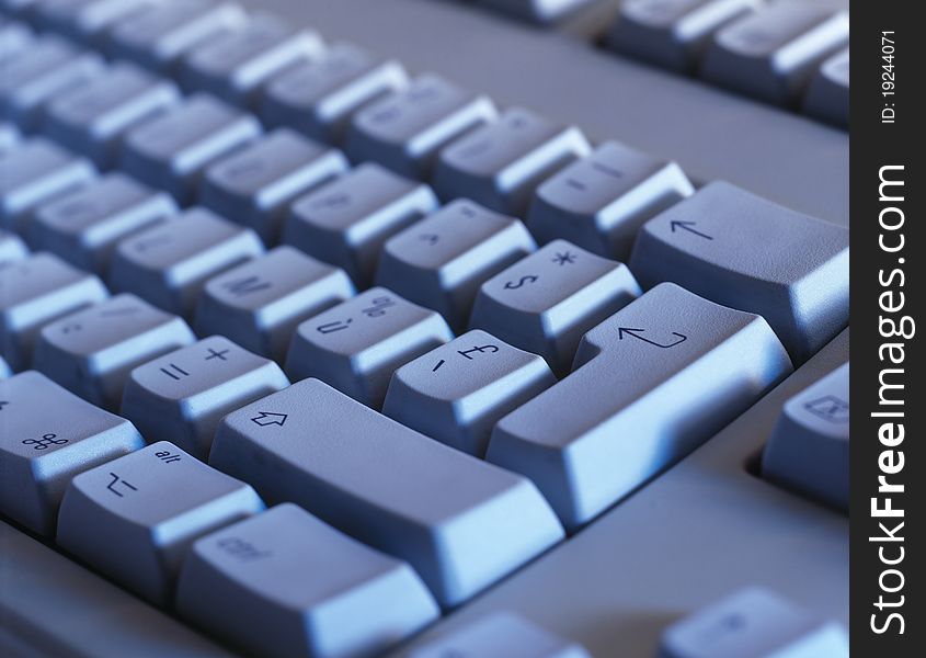 Computer keyboard close-up. Focused on 'Enter' key