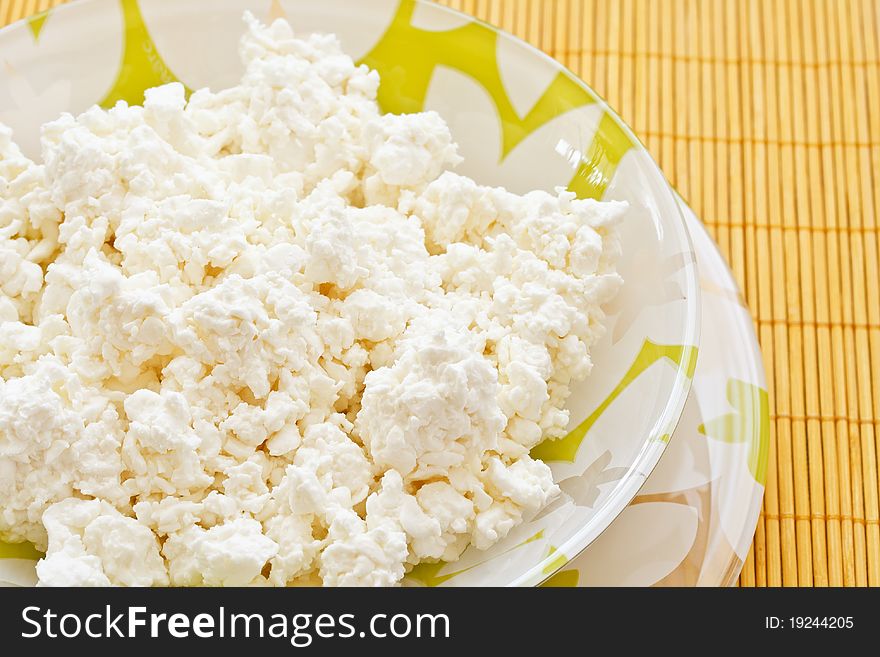 Fresh domestic milk cheese on a plate