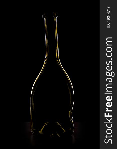 Glass bottle of wine on black background. Glass bottle of wine on black background