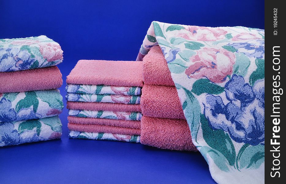 Pink and blue towel set on blue background