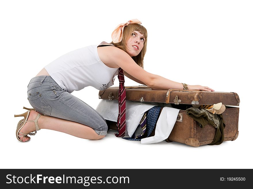 Housewife packing old suitcase for her husband's business trip. Housewife packing old suitcase for her husband's business trip