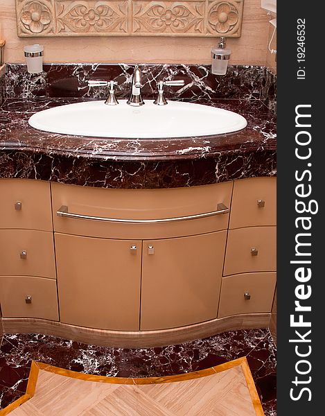 A luxurious marble wash basin portrait. A luxurious marble wash basin portrait