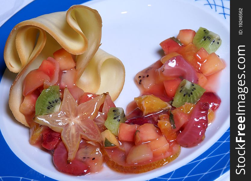 Fruit and berry salad: kiwis, grapes, apples and strawberry. Fruit and berry salad: kiwis, grapes, apples and strawberry