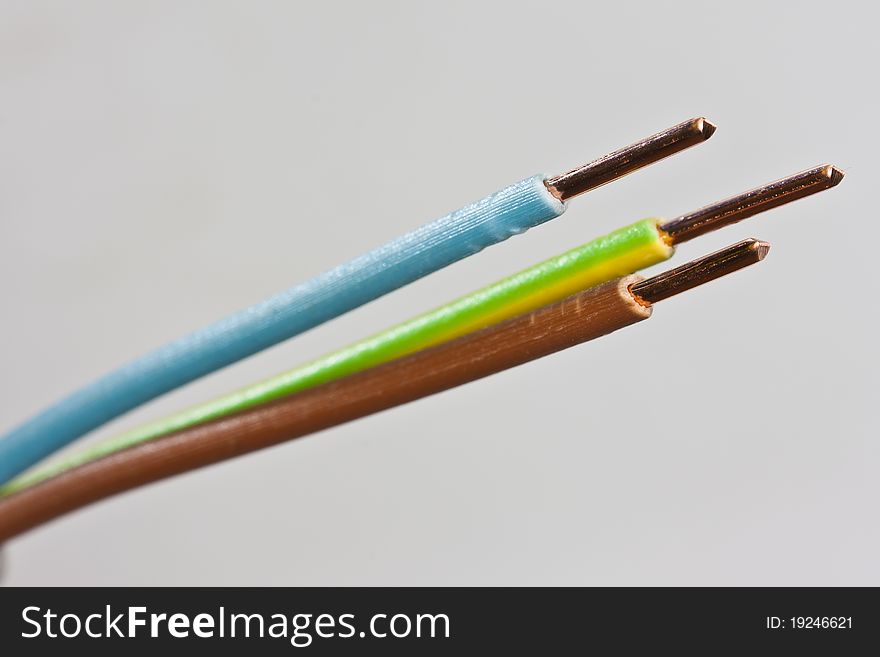 Closeup of three wires of an isolated power cable