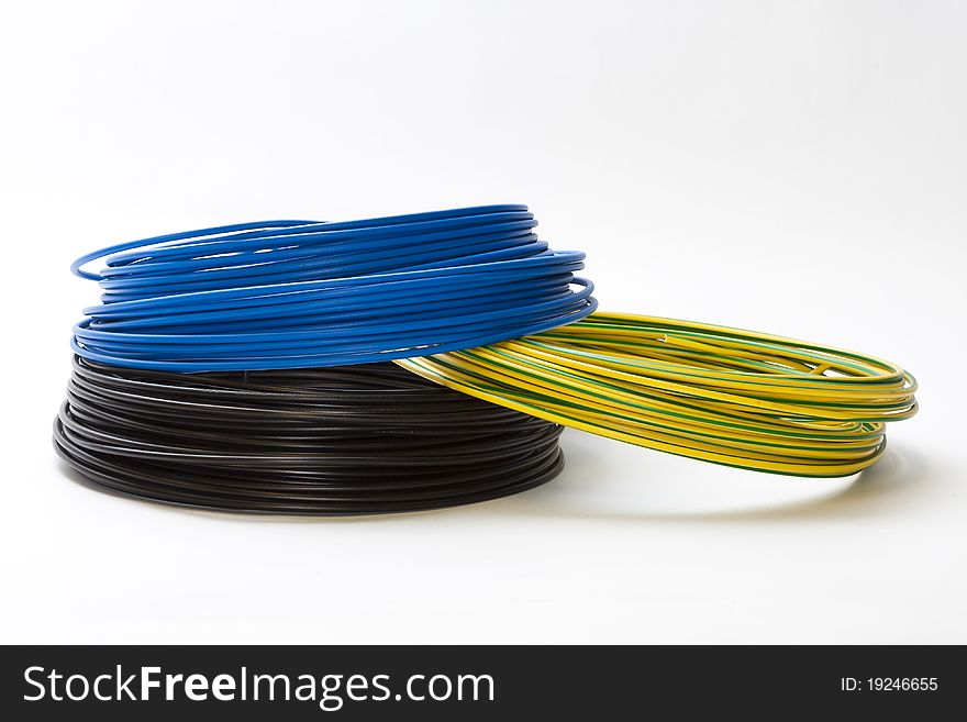 Single electric cables in blue, black an green-yellow. Single electric cables in blue, black an green-yellow