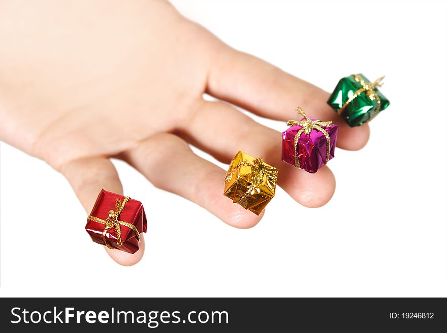 Closeup of human hand holding little gifts, isolated