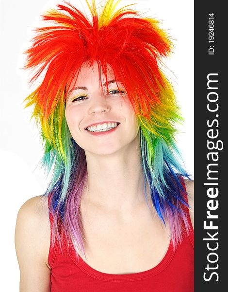 Woman in multicolored clown wig smiling