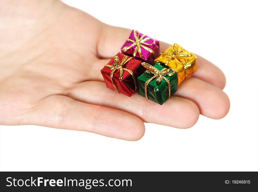 Closeup of human hand holding little gifts