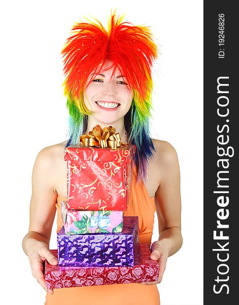 Young beauty woman in multicolored clown wig smiling and holding many gifts, isolated. Young beauty woman in multicolored clown wig smiling and holding many gifts, isolated
