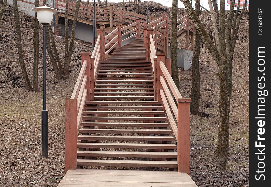 Wooden Stairs In The Old Park Among The Trees.