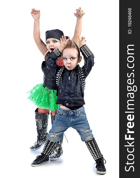 Shot of little boy and girl singing rock music in studio. Isolated over white background. Shot of little boy and girl singing rock music in studio. Isolated over white background.