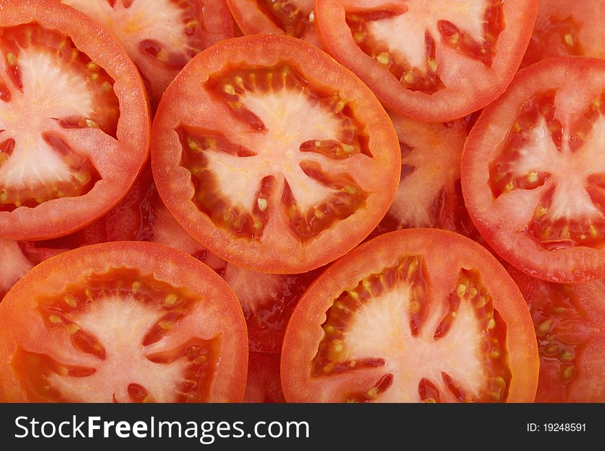Background with pieces of tomatoes