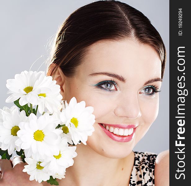 Portrait of a beautiful happy woman with white flowers. Portrait of a beautiful happy woman with white flowers