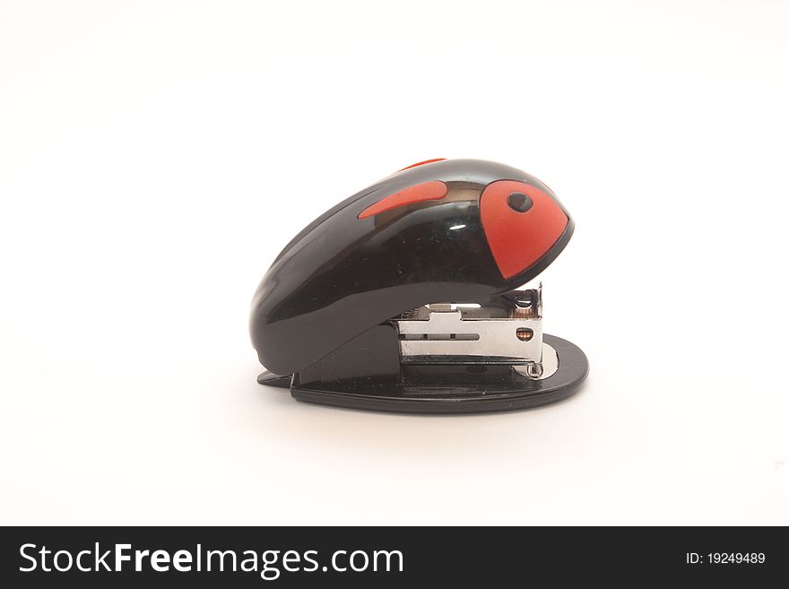 Small stapler black with red on a white background