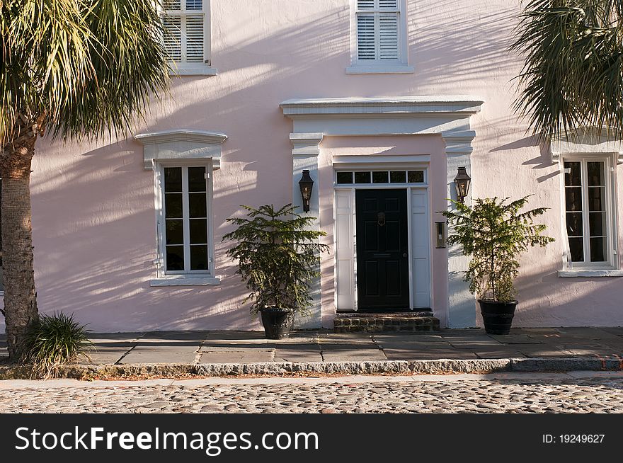 Front of an old southern luxury townhouse on a cobblestone street.  Charleston, South Carolina. Front of an old southern luxury townhouse on a cobblestone street.  Charleston, South Carolina.