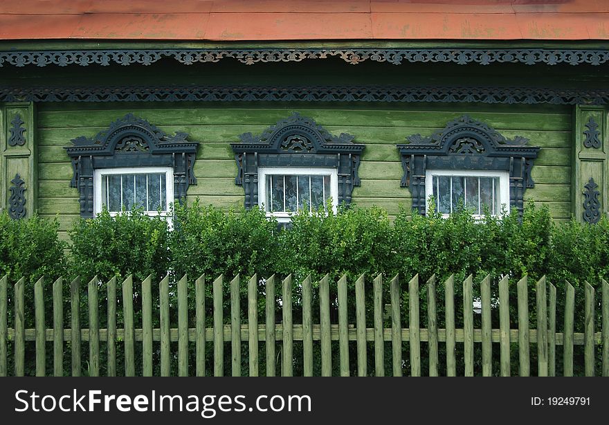 Windows of a old russian house with decorative carvings