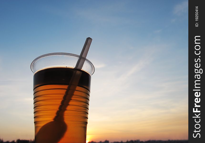 Black tea in a glass, sunset. Black tea in a glass, sunset.