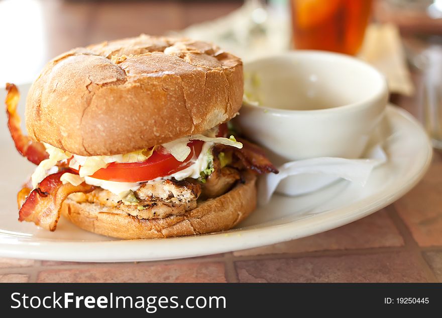 Chicken Sandwich with Bacon, Lettuce and Tomato served on a Toasted Bun