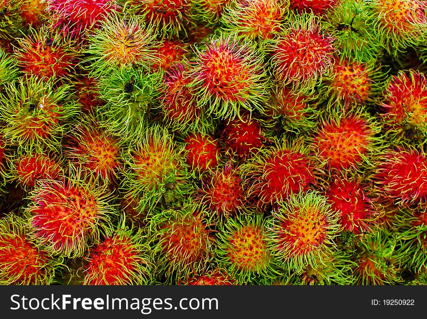 Fresh rambutans in market , closeup background, Asia , Thailand