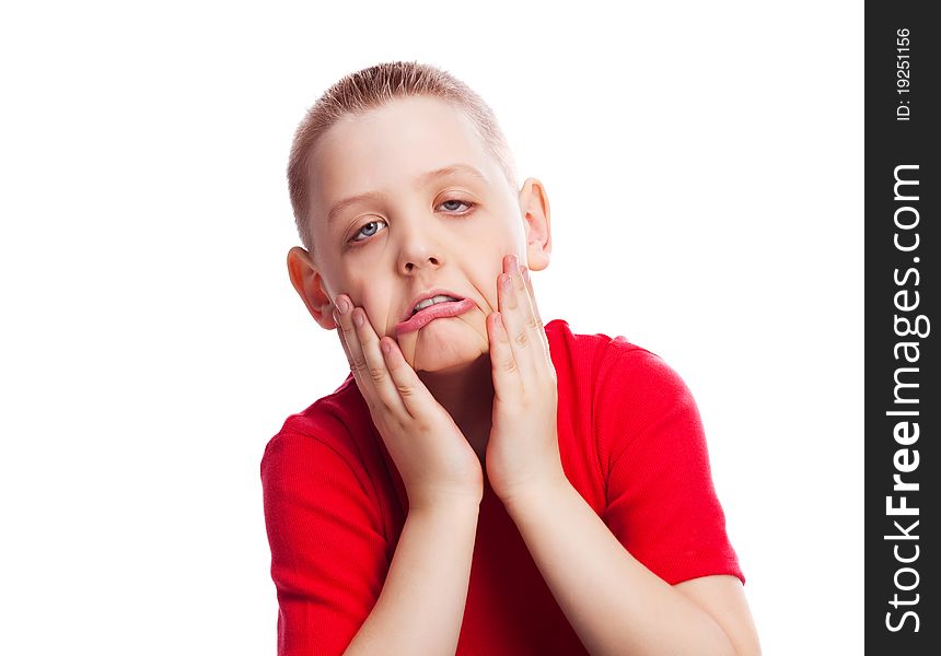 Happy ten year old boy making faces, isolated against white. Happy ten year old boy making faces, isolated against white