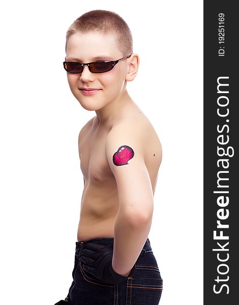 Ten year old boy with a tattoo of a heart on the arm