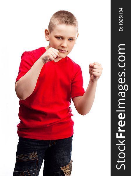 Aggressive ten year old boy showing his fists. Aggressive ten year old boy showing his fists