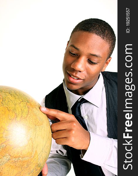 A smiling young man holding a globe. A smiling young man holding a globe