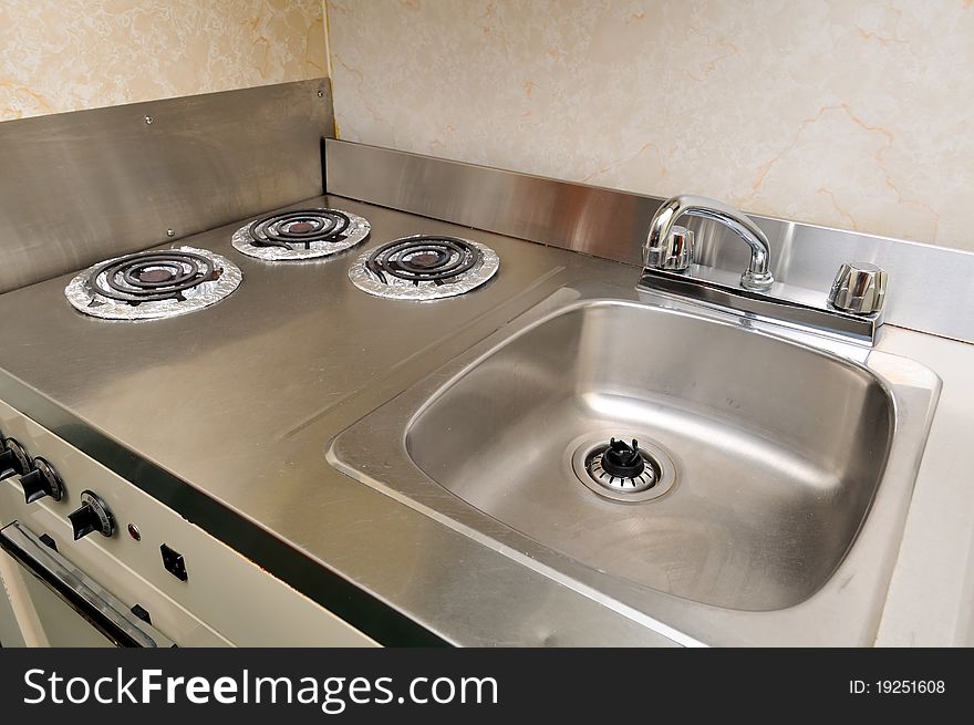 Clean cooking stoves with stainless steel washing area. Clean cooking stoves with stainless steel washing area.