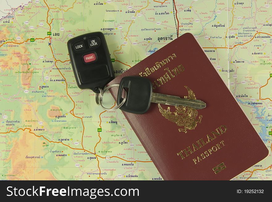 Passport And Car Key On Map