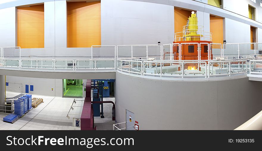 A side view of a large turbine powerhouse and plexiglass panels. A side view of a large turbine powerhouse and plexiglass panels.